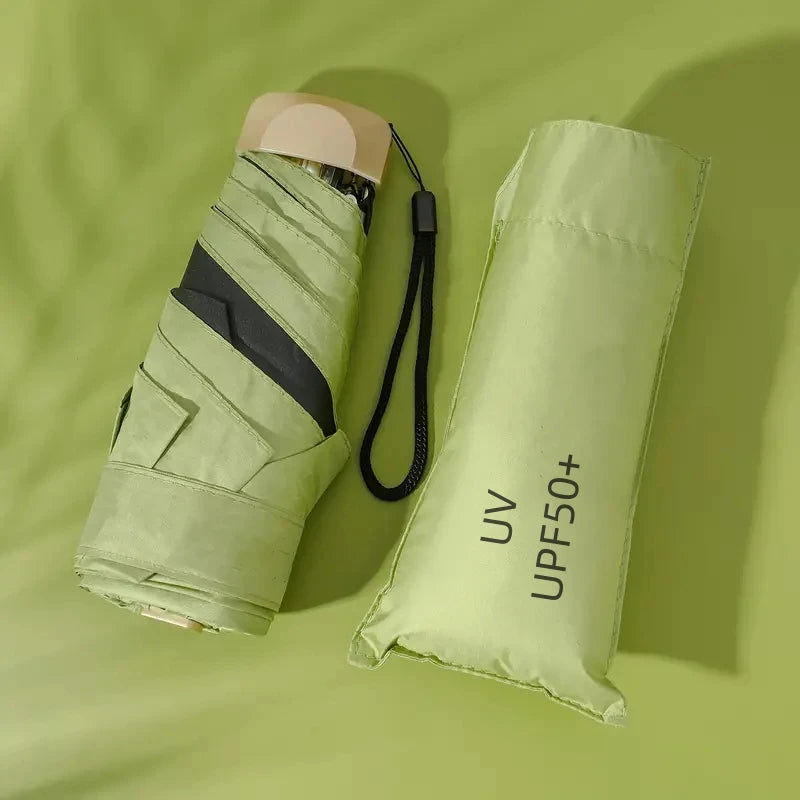 Compact green pocket umbrella with UV protection and five-fold design